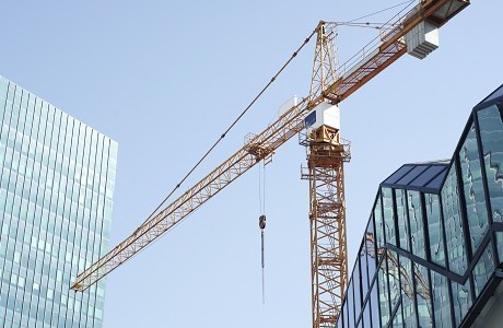 crane against glass city skyline, trade associations | Kerry London Construction insurance