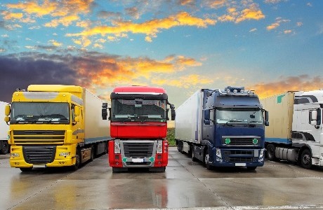 Fleet of large commercial lorries representing Fleet insurance