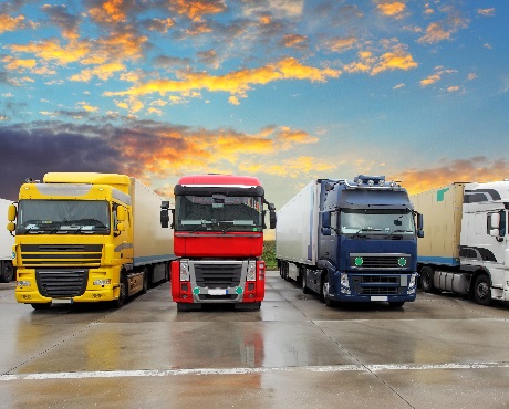 Fleet of large commercial lorries representing Fleet insurance