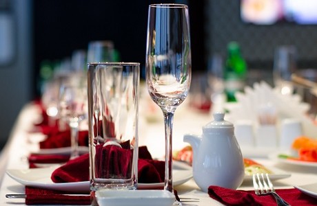 Set table with glasses, linen and cutlery, representing Hospitality insurance