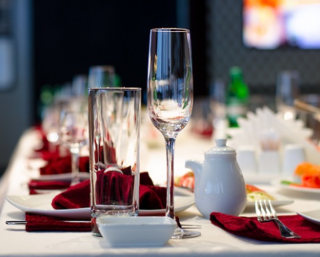 Set table with glasses, linen and cutlery, representing Hospitality insurance