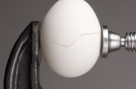 An egg being cracked, representing the value of brand reputation insurance