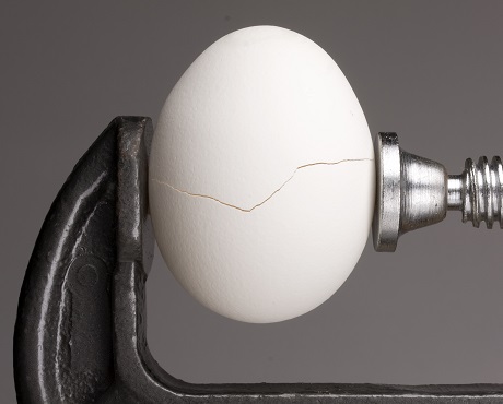 An egg being cracked, representing the value of brand reputation insurance