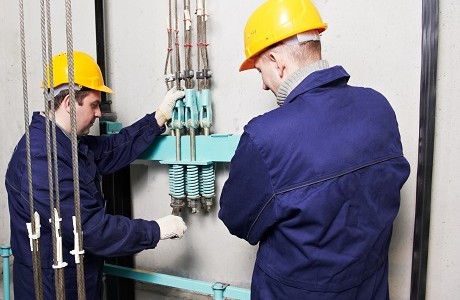 Engineers inspecting a lift representing Engineering insurance