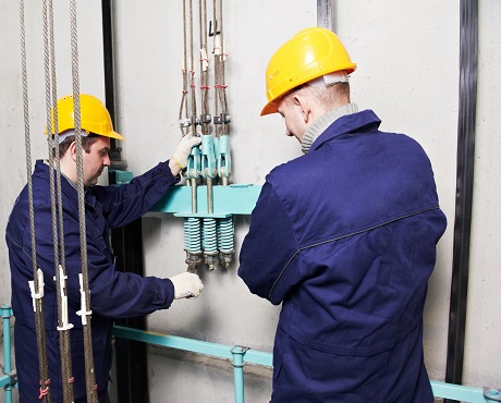 Engineers inspecting a lift representing Engineering insurance