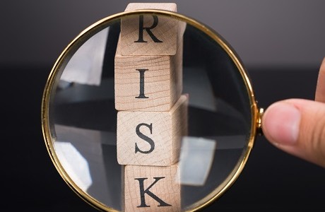 Wooden blocks spelling RISK, Specialised risks | Kerry London Limited