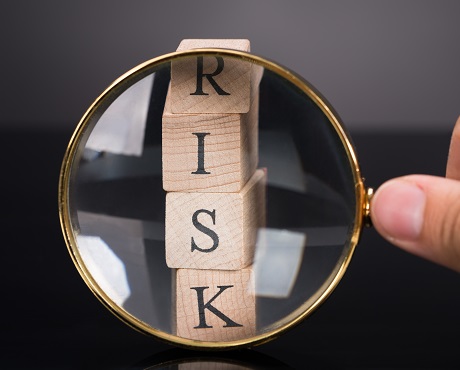 Wooden blocks spelling RISK, Specialised risks | Kerry London Limited